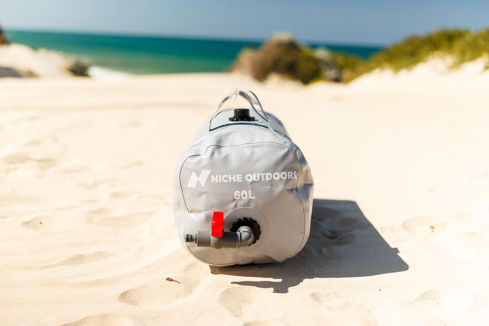 Niche Outdoors 60L Slim water bladder showing outlet valve and fittings